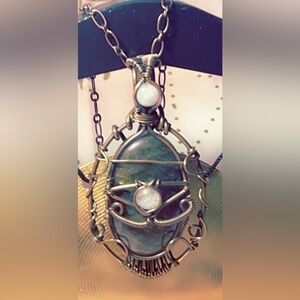 Eye of Horus wire wrap on 20”copper chain featuring Sunset Lab & Moonstone🌙